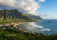 Lush Green Mountains Over a Calm Tropical Beach with Clear Blue Water