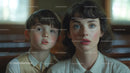 Woman with Dramatic Makeup and Young Boy in Indoor Nostalgic Scene