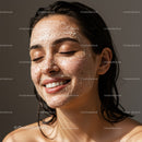 Young Woman Applying Facial Exfoliating Mask for Glowing Skin