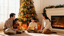 Family enjoying Christmas morning with gifts by tree
