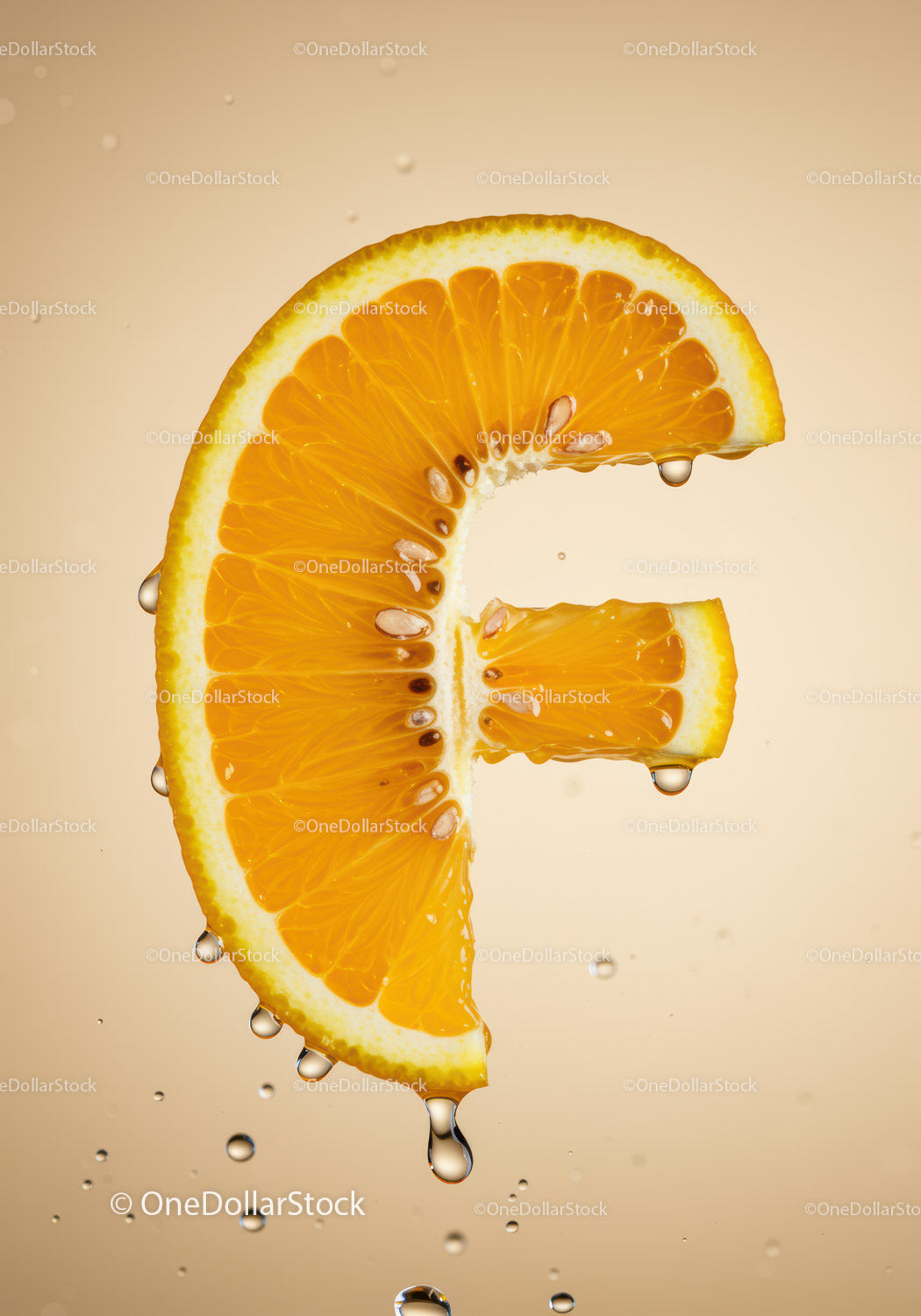Fresh orange slice shaped like letter F with water drops