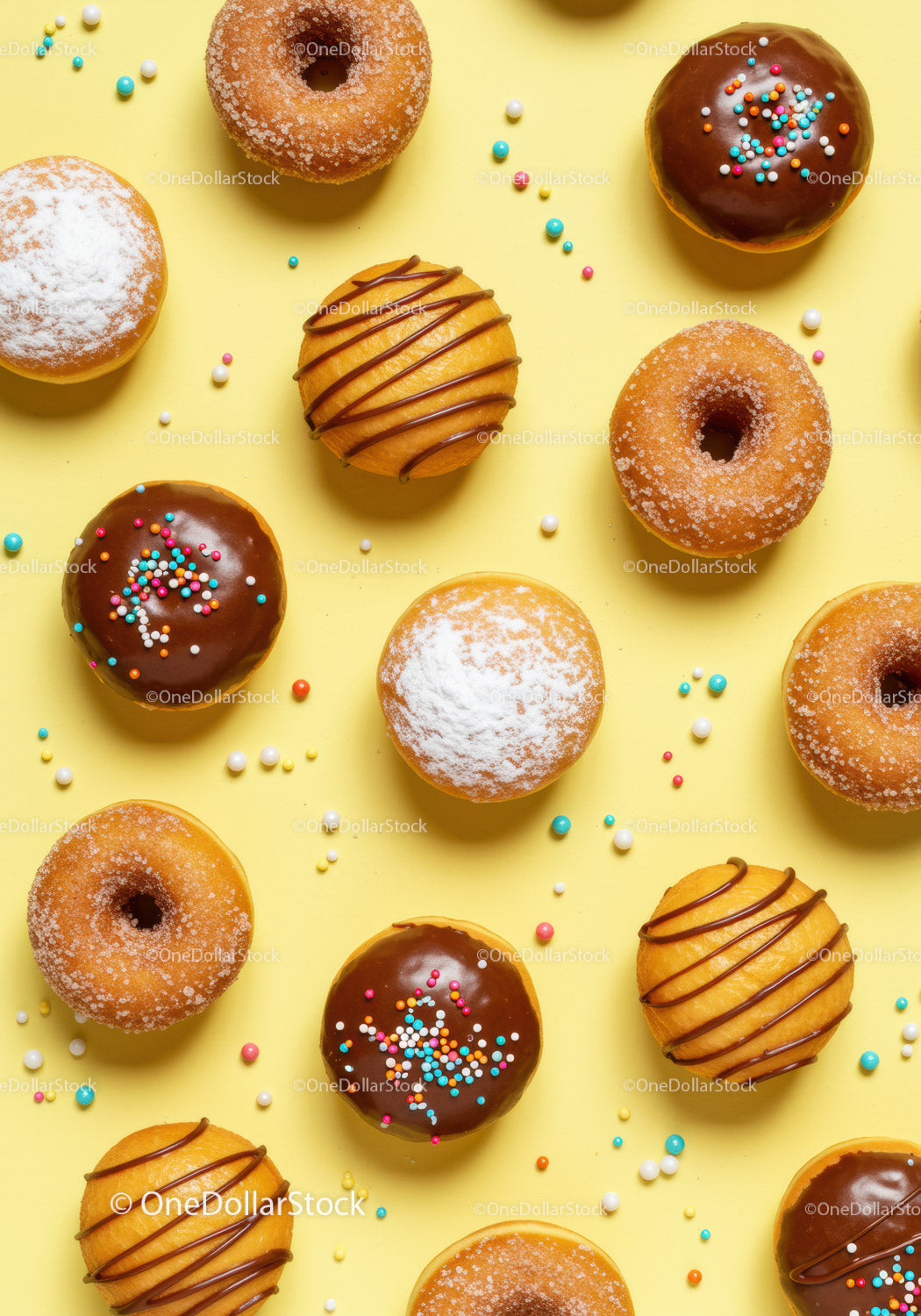 Assorted sweet donuts on a bright yellow background