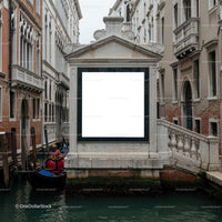 Venetian gondolier navigating narrow historic canal