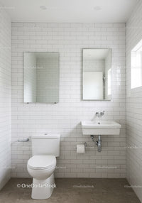 Minimalist White Subway Tile Bathroom with Compact Sink and Toilet