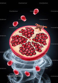 Fresh pomegranate seeds swirling in smoky mist