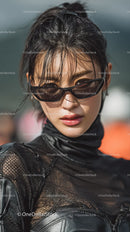 Chic Young Woman in Stylish Sunglasses and Black Outfit