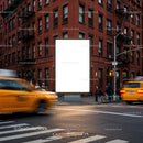 Urban street scene with bright blank billboard at intersection