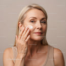 Woman Applying Face Cream for Anti-Aging Skincare Routine