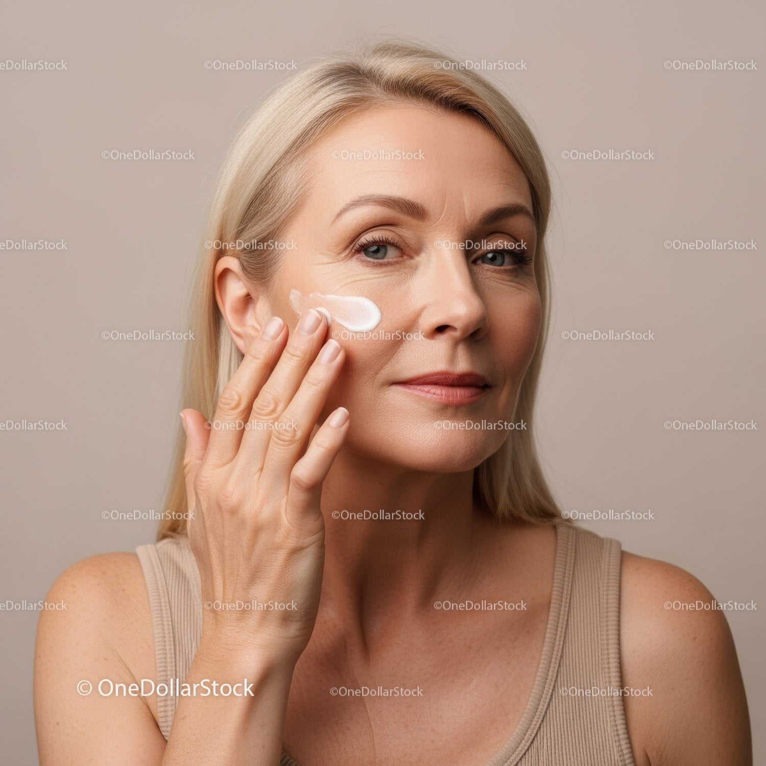 Woman Applying Face Cream for Anti-Aging Skincare Routine