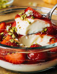 Creamy yogurt with fresh strawberries and pistachios