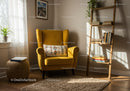 Cozy reading nook with yellow armchair and natural light