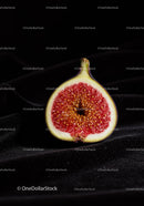 Close-up of Fresh Fig Half on Black Fabric
