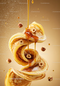 Swirling pancakes with hazelnuts and dripping syrup