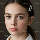 Close-Up Portrait of Young Woman with Pearl Hair Accessory and Earrings