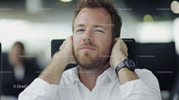 Confident Businessman Relaxing in Modern Office Setting