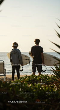 Two Surfers with Surfboards at Beach Ready for Waves