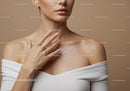 Elegant Woman Applying Skincare Cream on Shoulder in Close-Up