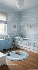 Cute Blue Baby Nursery Room with Cloud Wall Decals and Plush Toys