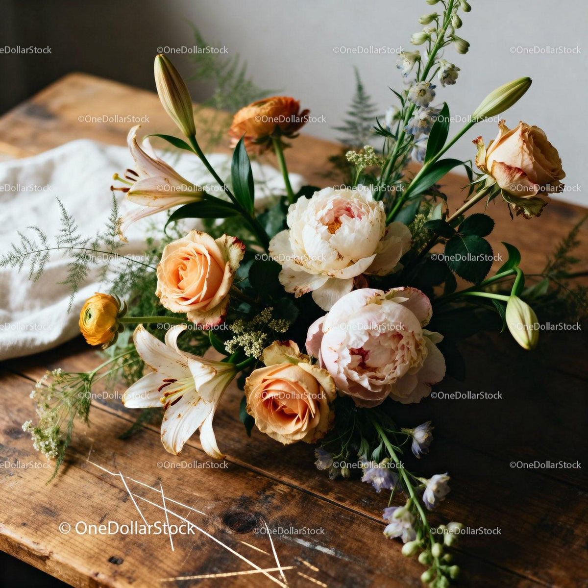 Delicate bouquet of pastel roses and lilies on wood