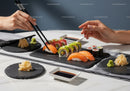 Fresh Sushi Platter with Salmon and Avocado on Black Slate Serving Plates