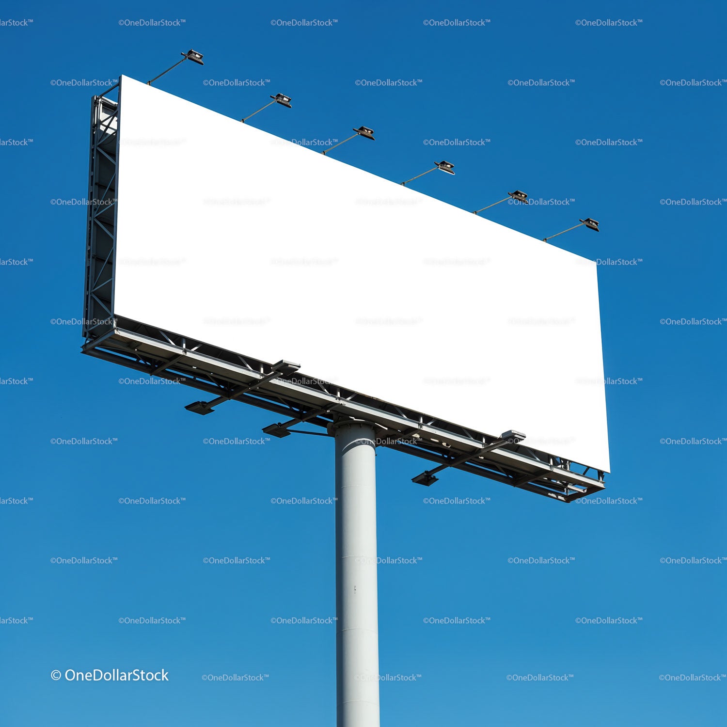 Empty billboard against clear blue sky on sunny day