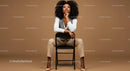 Stylish Confident Woman Sitting on Chair in Modern Studio
