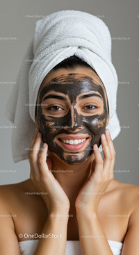 Young Woman with Black Facial Mask and Towel Wrapped Head