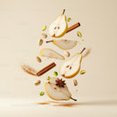 Sliced Pears with Spices and Pistachios Floating on Beige