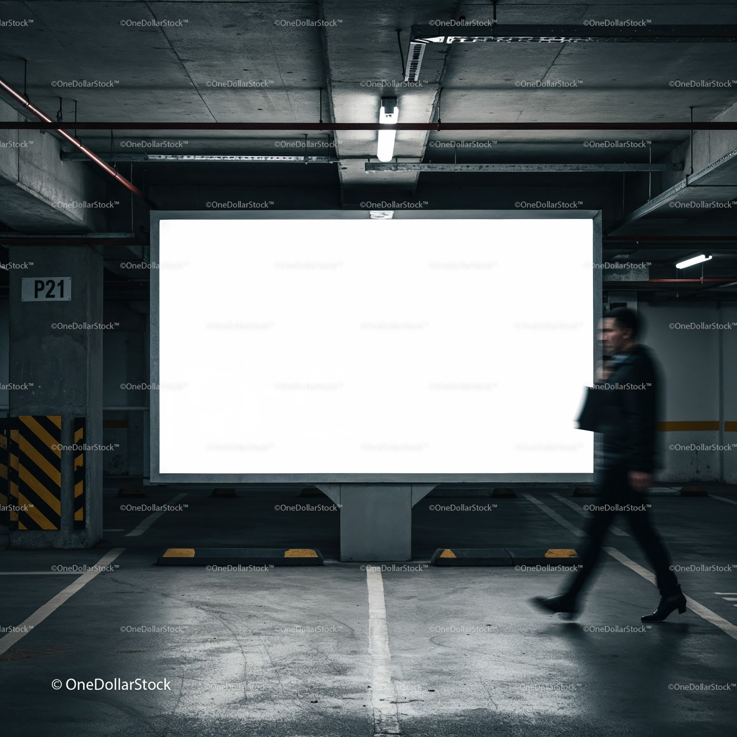 Businessman passing bright billboard in underground parking