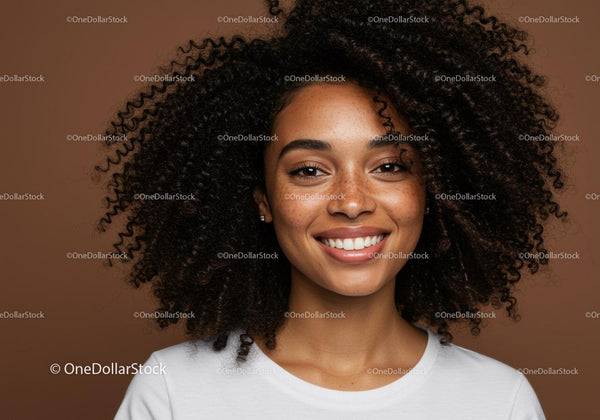 Portrait of a Smiling Woman with Curly Hair and Freckles in Indoor Setting