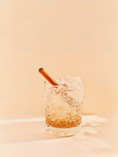 Refreshing cinnamon spiced iced drink in clear glass