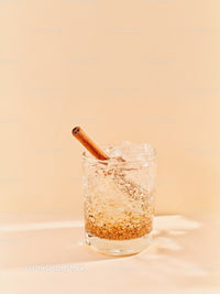 Refreshing cinnamon spiced iced drink in clear glass