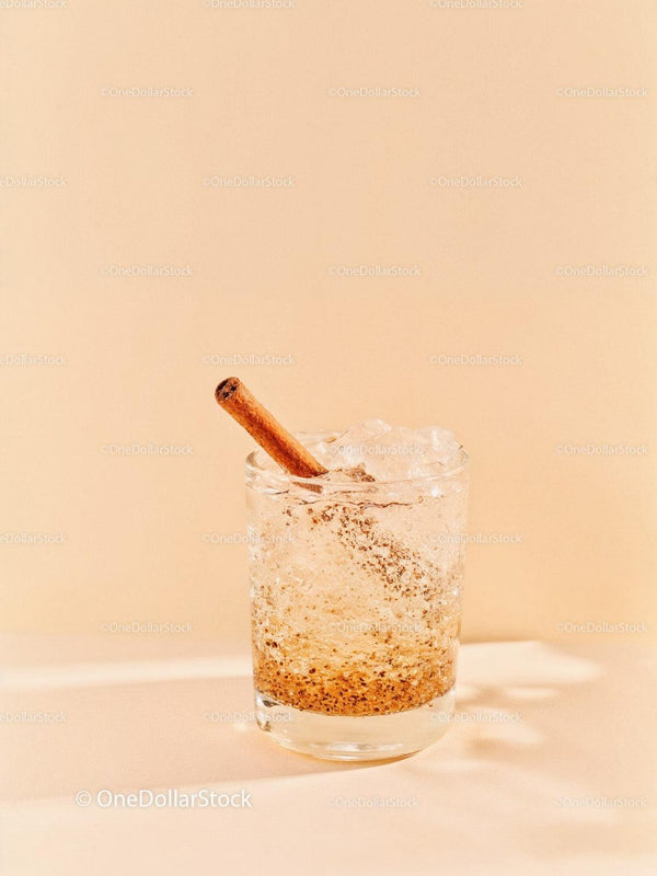 Refreshing cinnamon spiced iced drink in clear glass