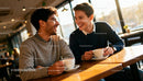 Couple Enjoying Coffee and Laughter in Cozy Cafe
