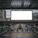 Urban street view from pedestrian overpass with blank billboard
