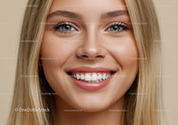 Close up of young woman smiling with bright eyes