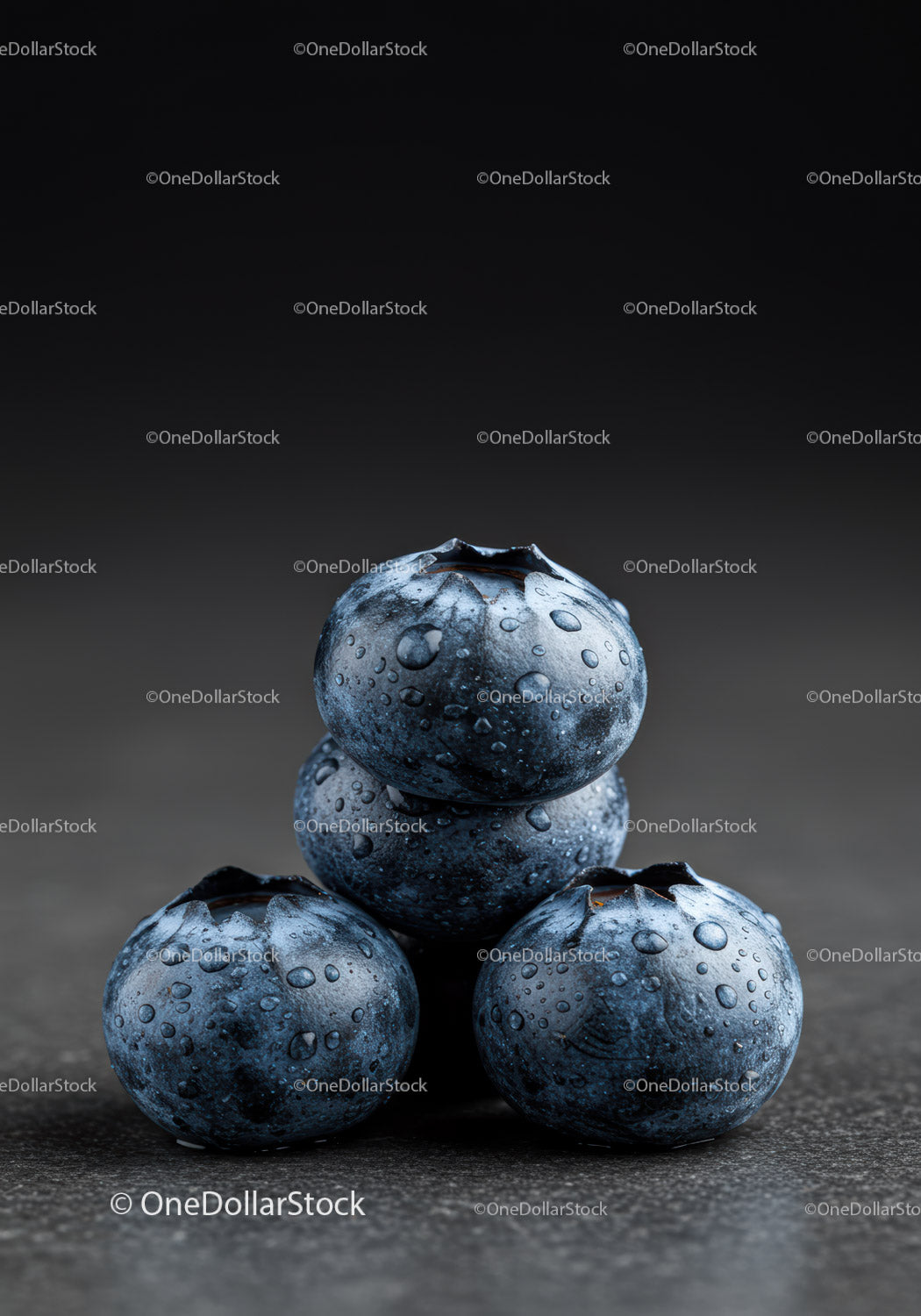 Fresh blueberries stacked on dark textured surface