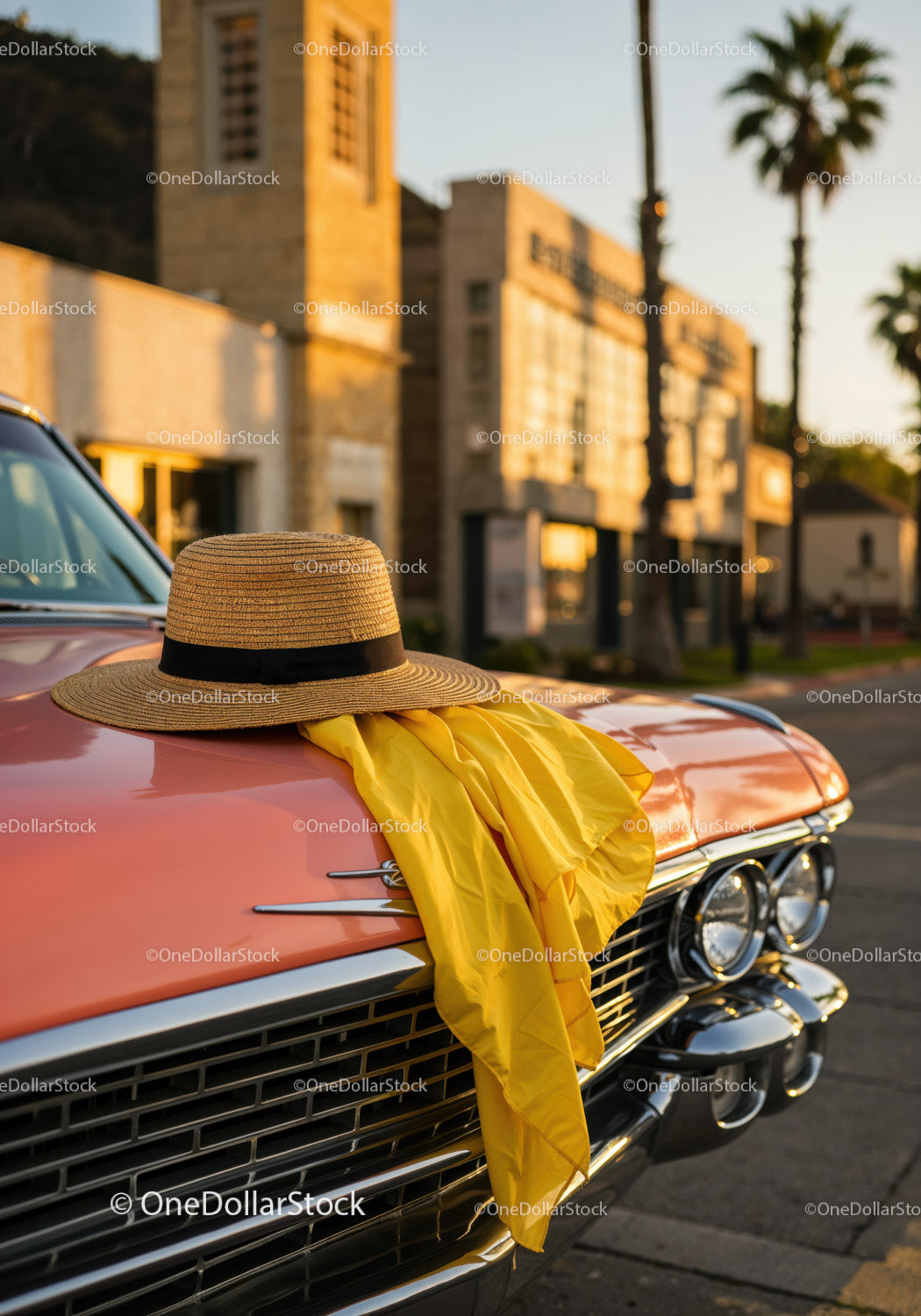 Vintage Orange Classic Car with Straw Hat and Yellow Scarf by Sunset