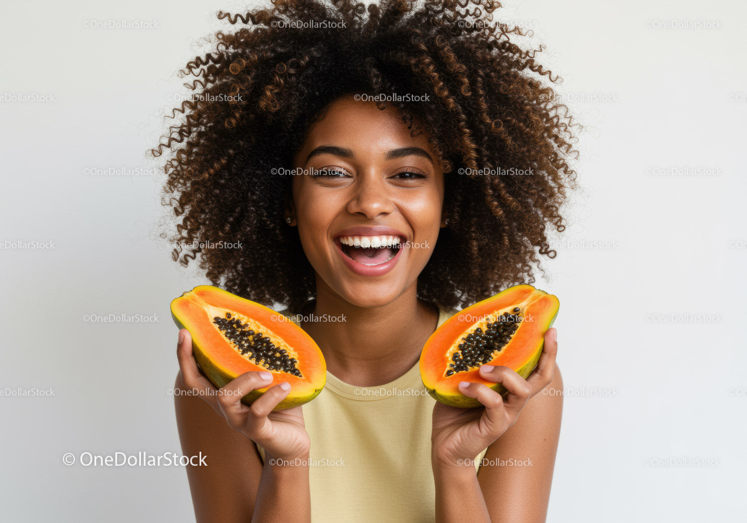 Smiling Black Woman Holding Fresh Halved Papayas for Healthy Lifestyle