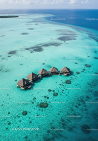 Overwater Bungalows in Turquoise Ocean with Sandbar and Coral Reef