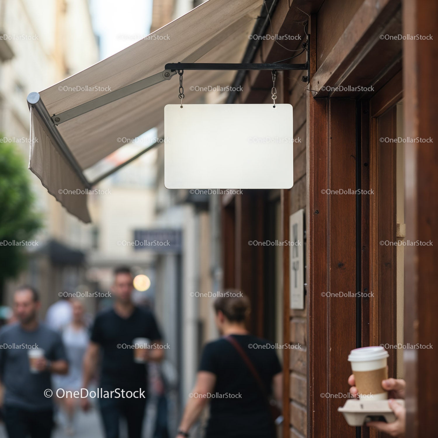 Blank street sign hanging outside urban coffee shop