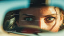 Close-up of Woman with Stylish Sunglasses and Captivating Eyes in Outdoor Setting