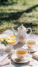 Elegant outdoor tea setting with lemon tarts