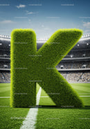 Grass-covered letter K on a sports field