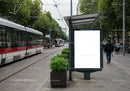 Modern urban tram stop with blank advertising board