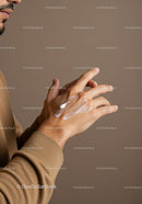 Close-Up of Man Applying Hand Lotion with Skincare Routine