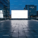 Blank illuminated billboard on urban rooftop at dusk