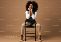 Thoughtful Woman Seated in Elegant Attire Against Brown Background