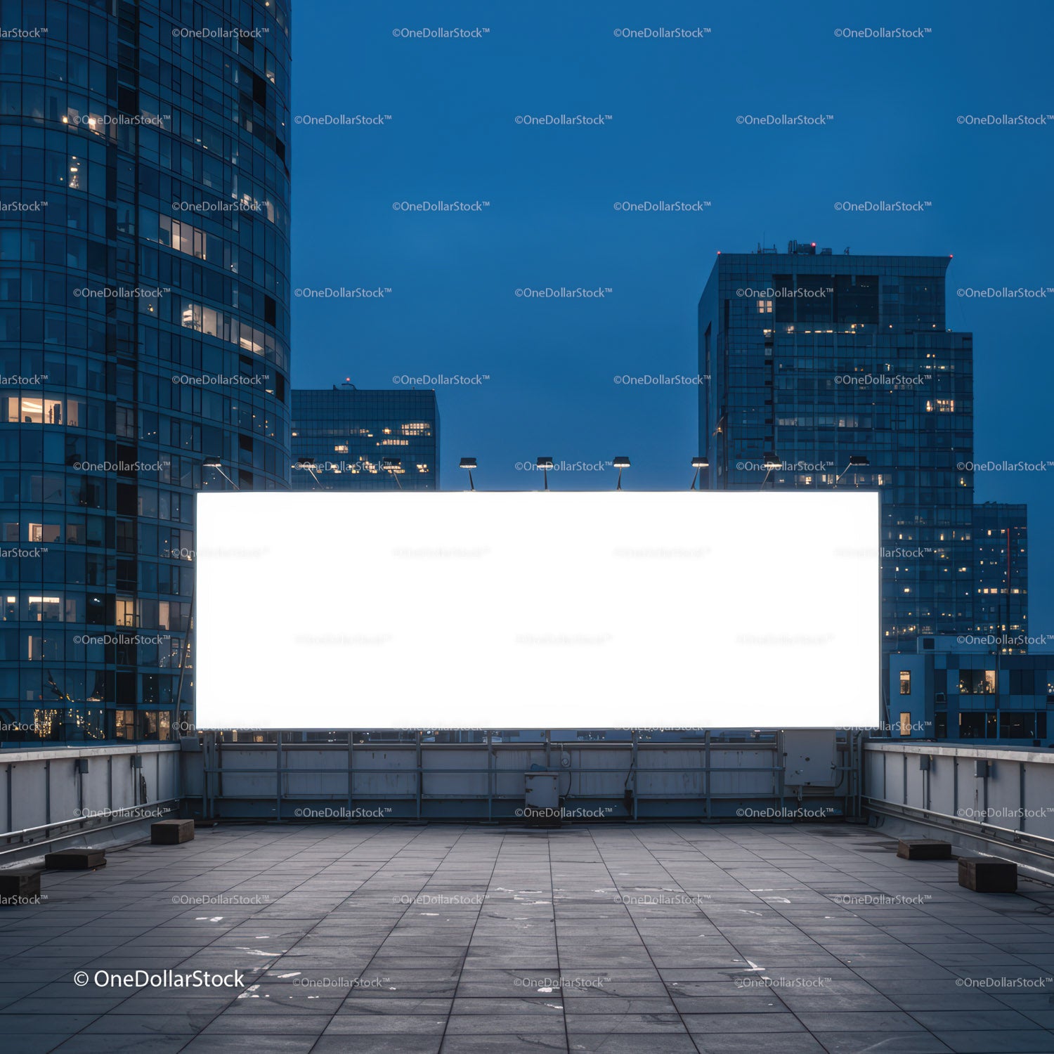 Empty illuminated billboard on rooftop at dusk