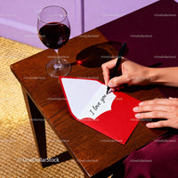 Writing a Romantic Love Note with Red Wine Nearby
